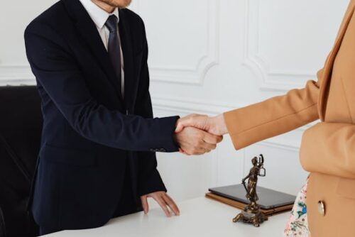 people in an office shaking hands